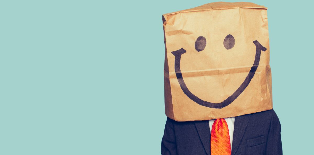 best employees - an employee with a paper bag on his head with a smiley face drawn.