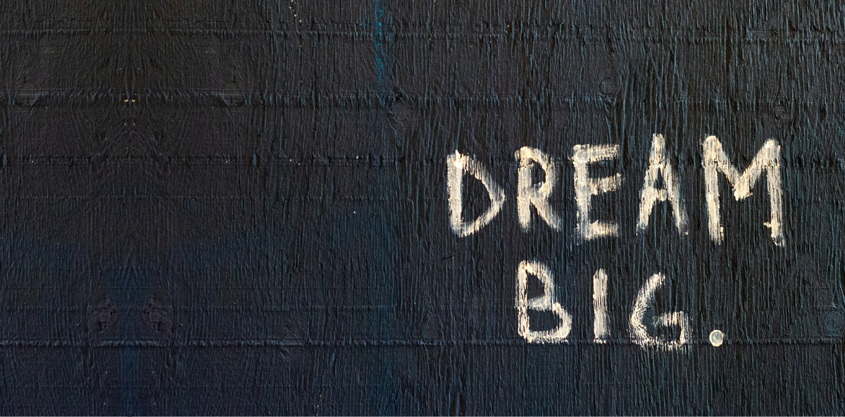 A chalkboard with big, all capitalized letters: DREAM BIG