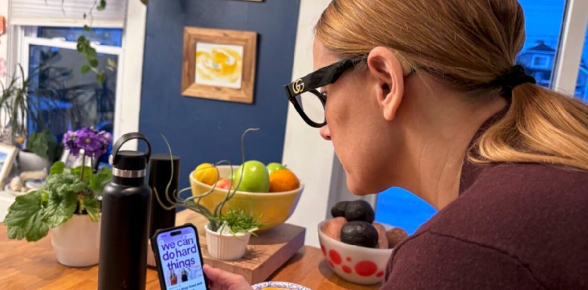 Glennda Testone indulging in her favorite habit, a podcast.